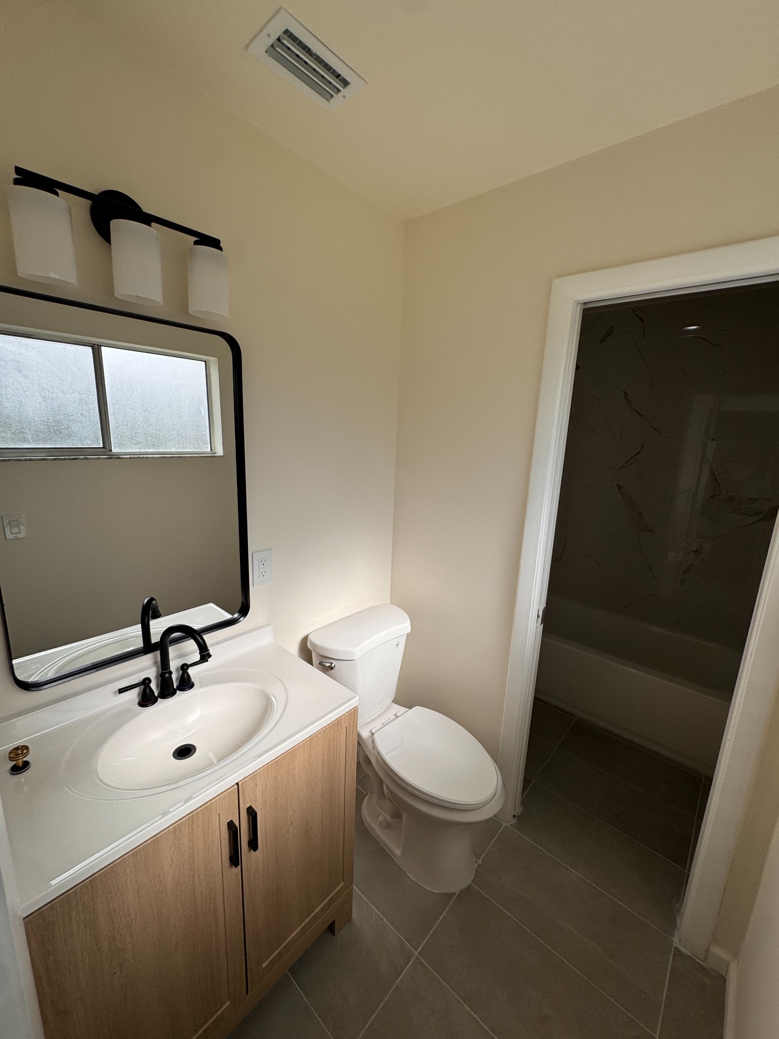 Renovated bathroom with freshly painted beige walls